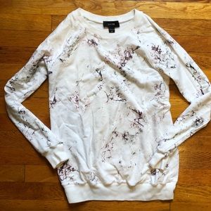 White crew neck sweater with marble fall design